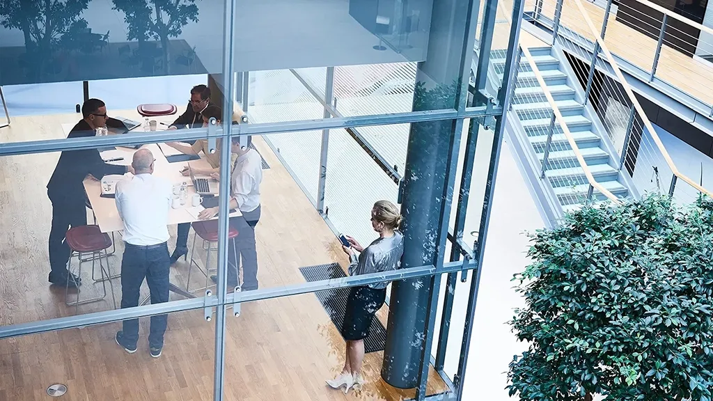 High-angle view of a business meeting in a modern office. 