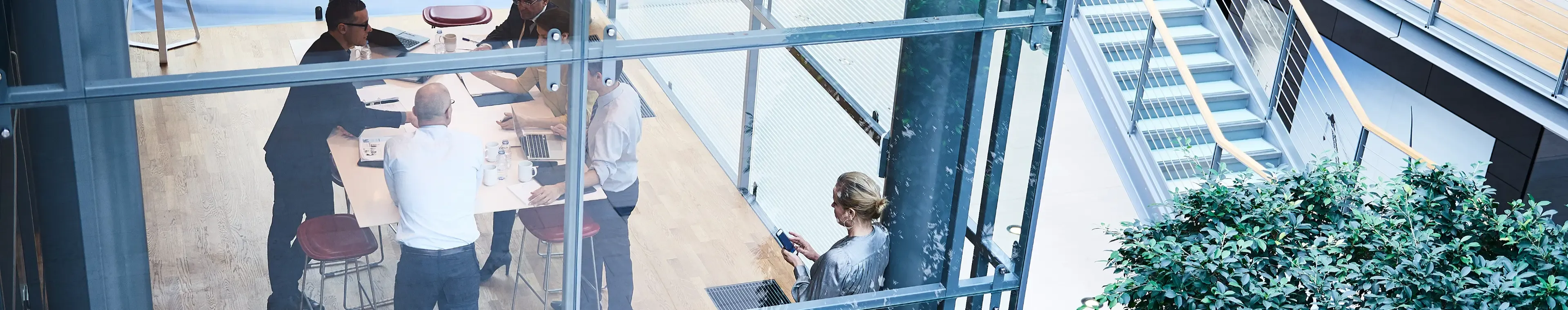 High-angle view of a business meeting in a modern office. 