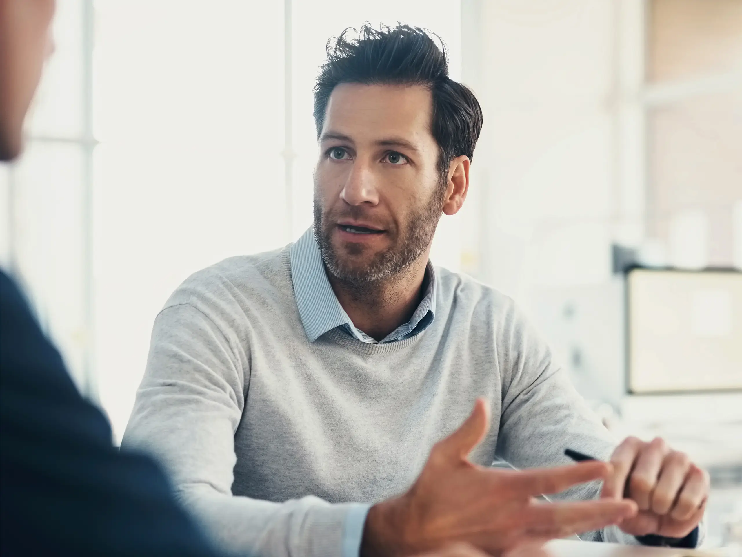 Man having a conversation in an office